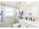 Bathroom featuring glass enclosed shower with modern fixtures and updated vanity at 7922 Elmstone Cir, Orlando, FL 32822