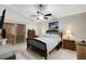 Bedroom with ceiling fan, bed, and dresser at 7922 Elmstone Cir, Orlando, FL 32822