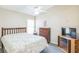 Bedroom with ceiling fan, closet, TV, and dresser at 7922 Elmstone Cir, Orlando, FL 32822