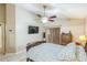 Bedroom with ceiling fan, bed, and TV at 7922 Elmstone Cir, Orlando, FL 32822