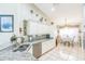Kitchen features granite countertops, stainless steel appliances, and a breakfast bar with seating at 7922 Elmstone Cir, Orlando, FL 32822