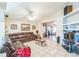 Spacious living room features vaulted ceilings, tile floors, a ceiling fan, and access to the enclosed patio at 7922 Elmstone Cir, Orlando, FL 32822