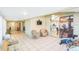 Spacious sunroom with tile floors, workout equipment, and access to the kitchen at 7922 Elmstone Cir, Orlando, FL 32822