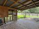 Backyard deck with latticework, wood floors and view of yard at 793 N Kentucky Ave, Umatilla, FL 32784