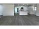 Open-concept living room featuring modern flooring and a bright, airy atmosphere at 793 N Kentucky Ave, Umatilla, FL 32784