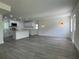 Open-concept living room featuring modern flooring and a bright, airy atmosphere at 793 N Kentucky Ave, Umatilla, FL 32784