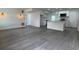 Open-concept living room featuring modern flooring and a bright, airy atmosphere at 793 N Kentucky Ave, Umatilla, FL 32784