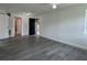 Open-concept living room featuring modern flooring and a bright, airy atmosphere at 793 N Kentucky Ave, Umatilla, FL 32784
