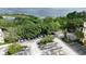 Aerial view of parking lot, trees, and green space surrounding the commercial building at 8057 Marcella Dr, Orlando, FL 32836