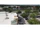 Aerial view of a commercial parking lot, trees, and buildings at 8057 Marcella Dr, Orlando, FL 32836