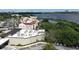 Aerial view of a multistory commercial building, parking lot, and waterway at 8057 Marcella Dr, Orlando, FL 32836
