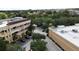 Aerial view of a commercial building with mature trees and landscaping at 8057 Marcella Dr, Orlando, FL 32836