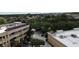 Birds eye view of the commercial building with lush trees and parking lot at 8057 Marcella Dr, Orlando, FL 32836
