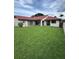An expansive backyard featuring lush green grass and a well-maintained landscape enhances outdoor living at 8057 Marcella Dr, Orlando, FL 32836