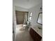 Bathroom with shower-tub combo, toilet, vanity with mirror and fixtures, and tile floors at 8057 Marcella Dr, Orlando, FL 32836