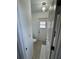 Small bathroom featuring a toilet and door leading to the exterior at 8057 Marcella Dr, Orlando, FL 32836