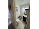 Bathroom featuring a toilet, vanity with mirror and fixtures, tile floors, and natural lighting at 8057 Marcella Dr, Orlando, FL 32836