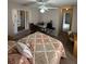 Bedroom with carpet flooring, ceiling fan, natural light, and a desk area with a chair at 8057 Marcella Dr, Orlando, FL 32836