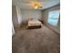 Bedroom featuring a comfortable bed and carpet floors at 8057 Marcella Dr, Orlando, FL 32836