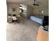 Spacious main bedroom featuring a ceiling fan, neutral carpet, and a connected bathroom at 8057 Marcella Dr, Orlando, FL 32836