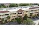 Exterior of a multistory commercial building, with barrel tile roof and portico at 8057 Marcella Dr, Orlando, FL 32836