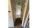 Hallway featuring two closets and an access to various rooms in the house at 8057 Marcella Dr, Orlando, FL 32836