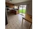 Cozy kitchen with wood cabinets, stainless steel appliances, and a sliding glass door to the backyard at 8057 Marcella Dr, Orlando, FL 32836