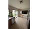 Kitchen with wood cabinets, stainless steel appliances, and a glass door to the backyard at 8057 Marcella Dr, Orlando, FL 32836