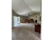 Spacious living room with vaulted ceilings, plush carpeting, and a cozy fireplace at 8057 Marcella Dr, Orlando, FL 32836