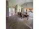 Cozy living area offering an inviting space, that leads to an adjacent dining area and front door at 8057 Marcella Dr, Orlando, FL 32836