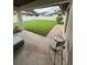 Covered patio overlooking a well-maintained yard, offering a tranquil outdoor space at 8057 Marcella Dr, Orlando, FL 32836