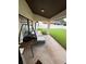 Covered patio with comfortable seating and a grill, perfect for outdoor relaxation and dining at 8057 Marcella Dr, Orlando, FL 32836