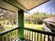 Balcony showing peaceful and green landscape with lush trees, extending from an exterior corner at 806 Pinewood Ct # 3135/6, Haines City, FL 33844