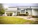 Charming multi-level home featuring stone accents, covered balcony, and lush landscaping at 806 Pinewood Ct # 3135/6, Haines City, FL 33844