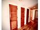 Hallway with access to storage room, featuring hardwood floors and recessed lighting at 806 Pinewood Ct # 3135/6, Haines City, FL 33844
