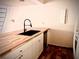 Well-appointed kitchen featuring modern countertops, white cabinetry, and a stylish faucet at 806 Pinewood Ct # 3135/6, Haines City, FL 33844