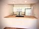 Fully equipped kitchen featuring modern appliances and breakfast bar at 806 Pinewood Ct # 3135/6, Haines City, FL 33844