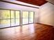 Bright living room featuring hardwood floors and access to a private balcony with scenic views at 806 Pinewood Ct # 3135/6, Haines City, FL 33844