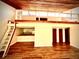 Unique loft with ladder, and a view to kitchen area and entrance to bedrooms at 806 Pinewood Ct # 3135/6, Haines City, FL 33844