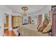 Luxurious bedroom with chandelier, water view, and antique-style armoire at 822 W Patterson St, Lakeland, FL 33803