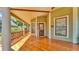 Inviting covered front porch with stained wood flooring at 822 W Patterson St, Lakeland, FL 33803