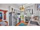 Bright, updated kitchen with stainless steel appliances, granite counters, custom cabinetry, and hardwood floors at 822 W Patterson St, Lakeland, FL 33803