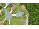 Aerial view of home featuring in-ground pool, mature trees, and large lawn at 911 Mendoza Ln, Kissimmee, FL 34758