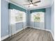Cozy bedroom with a ceiling fan and natural light at 911 Mendoza Ln, Kissimmee, FL 34758