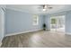 Bedroom with neutral walls, tile floors and sliding door access to lanai at 911 Mendoza Ln, Kissimmee, FL 34758
