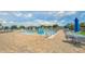 Large community pool with slides, splash features, lounge chairs, and umbrellas for residents' enjoyment at 911 Mendoza Ln, Kissimmee, FL 34758