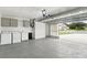 Spacious garage with laundry area, utility sink, and plenty of room for storage at 911 Mendoza Ln, Kissimmee, FL 34758