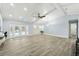 Bright living room with high ceilings, tile floors, and an open view of the pool area at 911 Mendoza Ln, Kissimmee, FL 34758