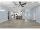 Bright living room featuring a spacious open floor plan and vaulted ceilings at 911 Mendoza Ln, Kissimmee, FL 34758