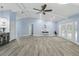 Open-concept living room with access to the patio through sliding glass doors at 911 Mendoza Ln, Kissimmee, FL 34758